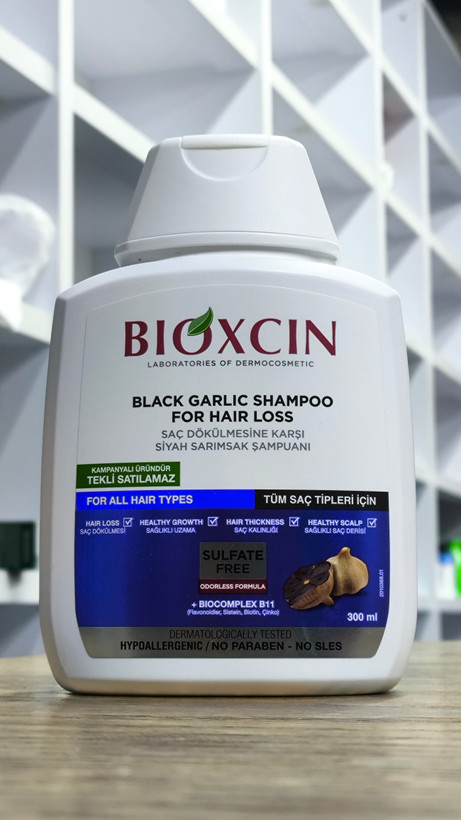 شامپو مو سیر سیاه بیوکسین BIOXCIN ضد ریزش و ترمیم کننده ریشه مو حجم 300 میلی لیتر